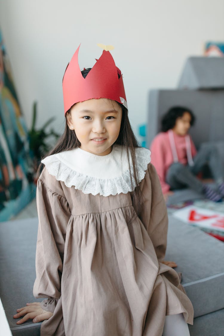 Pretty Girl Wearing Red Paper Hat 