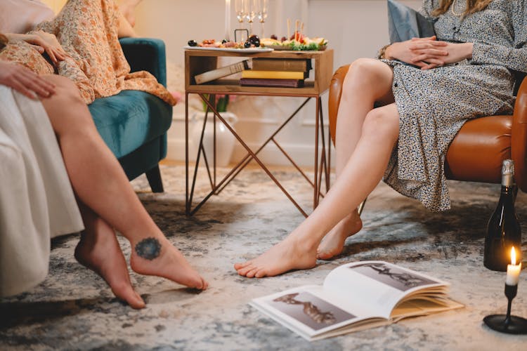 Women Relaxing At A Party With Bare Feet