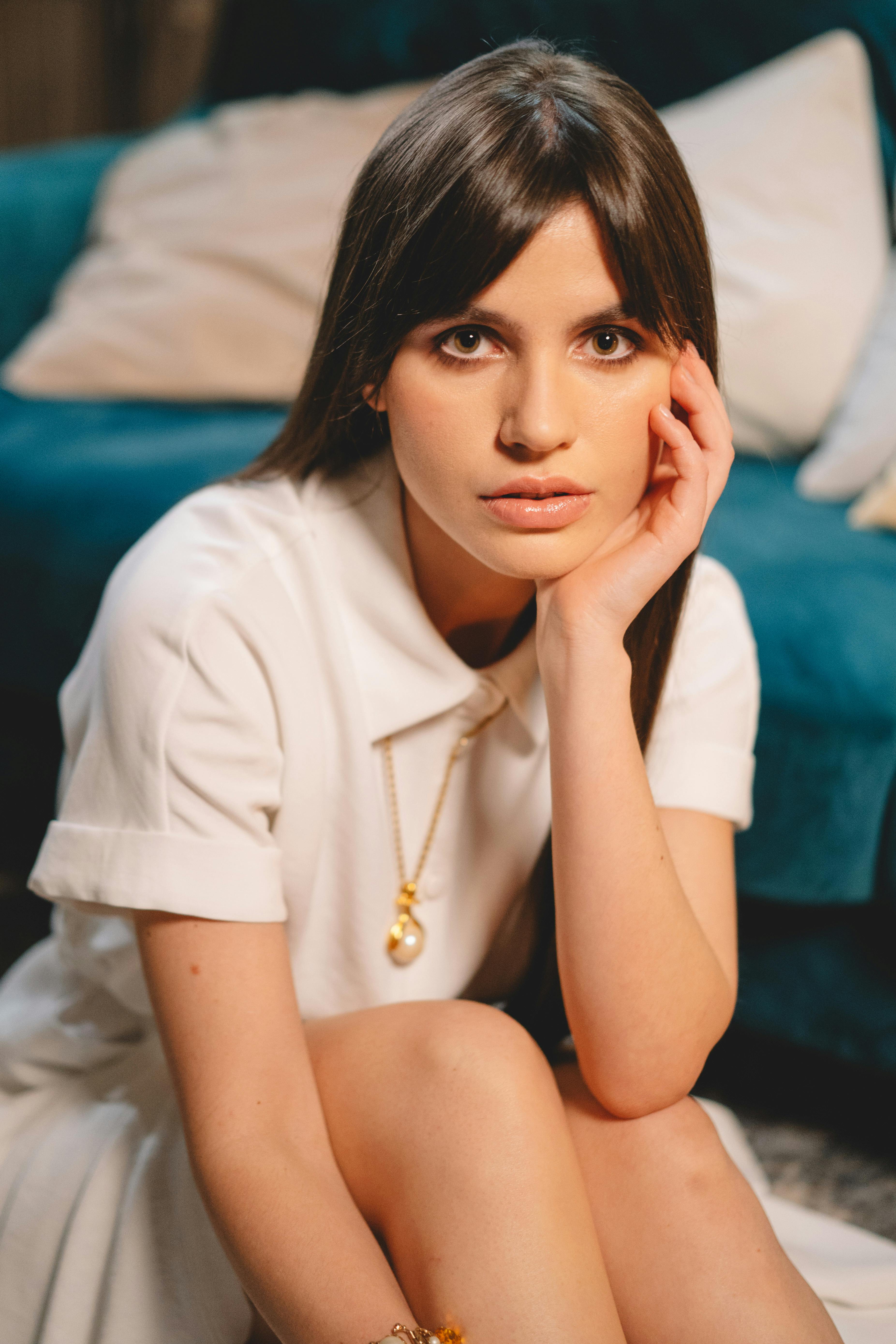 portrait of a woman with straight hair and necklace