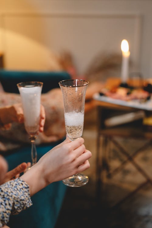 People Holding a Champagne Glasses 