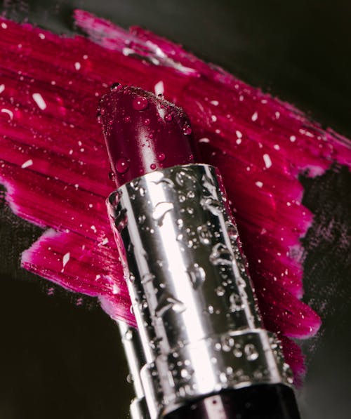 Close-Up Photo of a Lipstick with Water Droplets