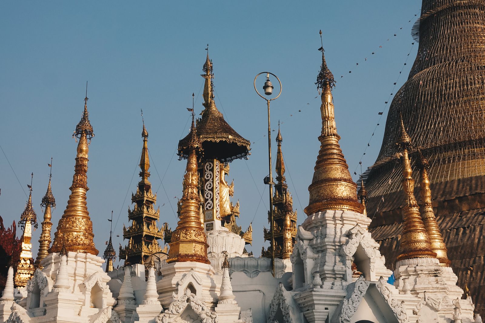 Crowds celebrating at a colorful Myanmar festival with water and lights