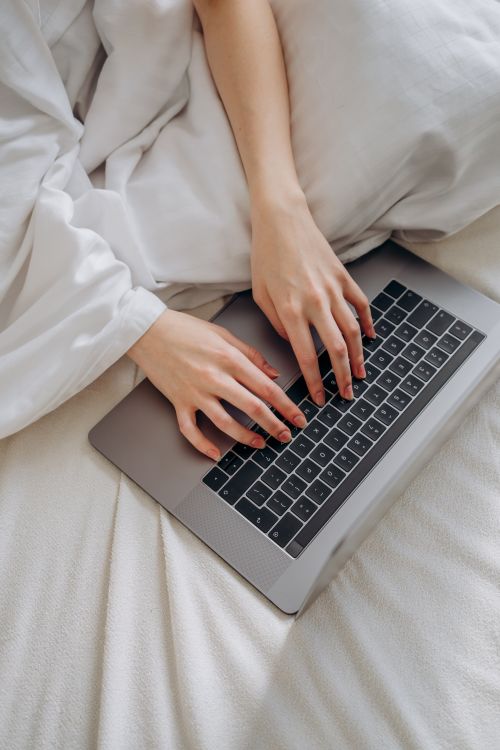 A Person Typing on a Laptop · Free Stock Photo