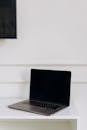 Black Laptop on White Table