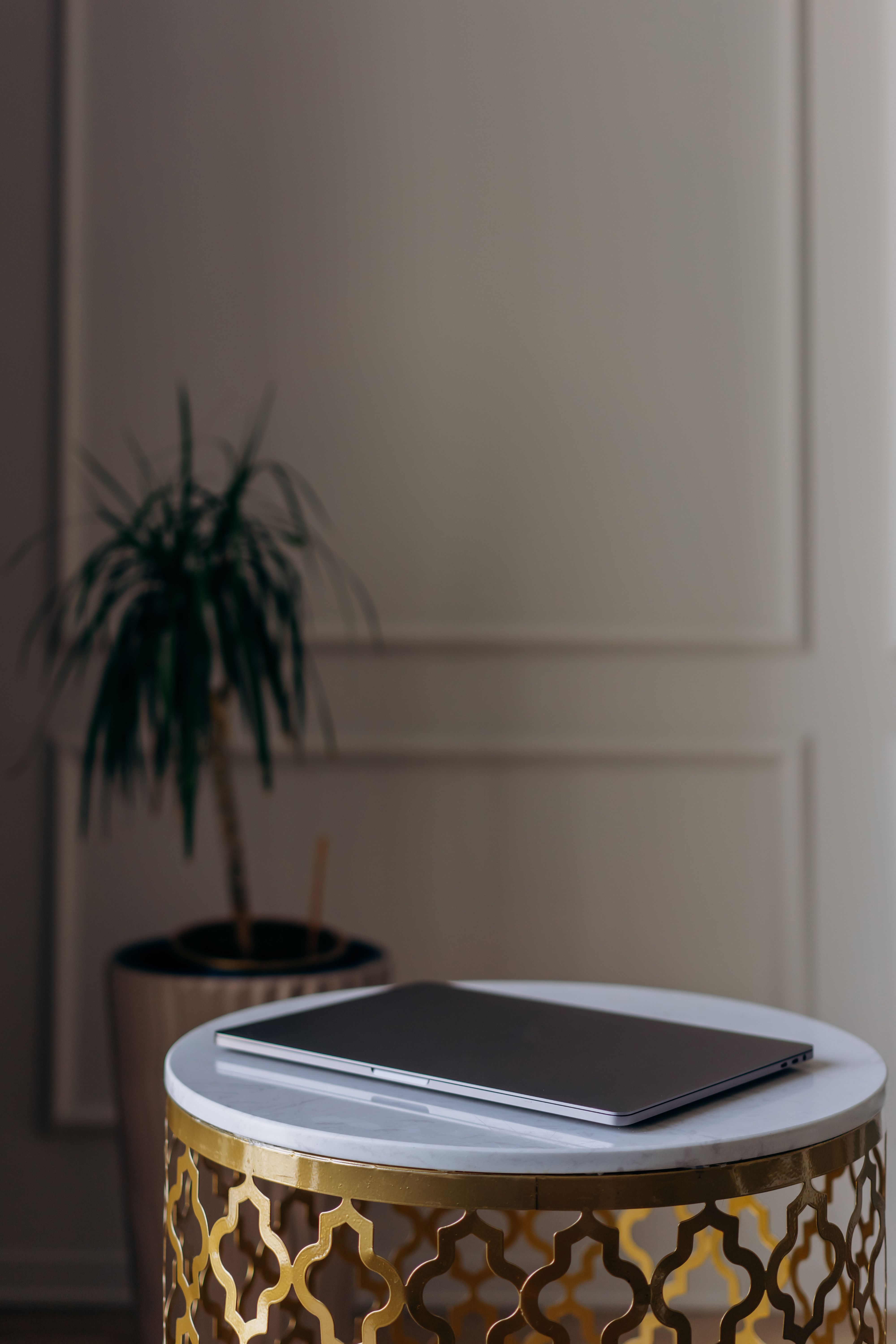 Black Laptop on a Round Table · Free Stock Photo