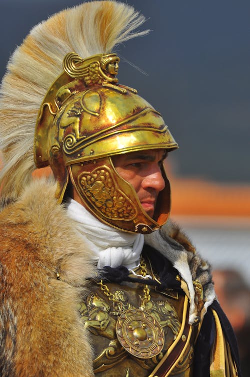 Man in Gold and White Costume