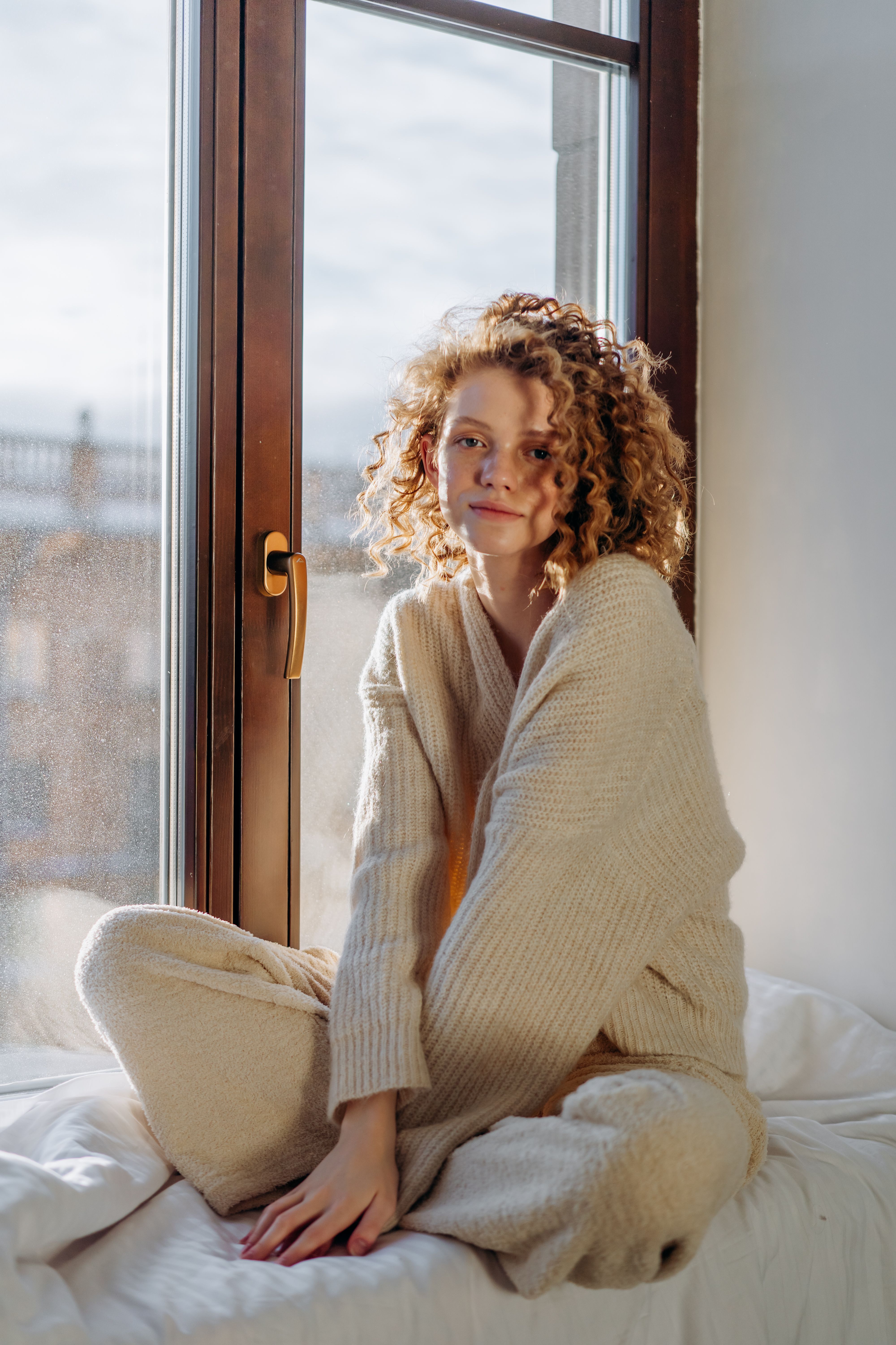 Woman in Light Green Sweater Writing on 