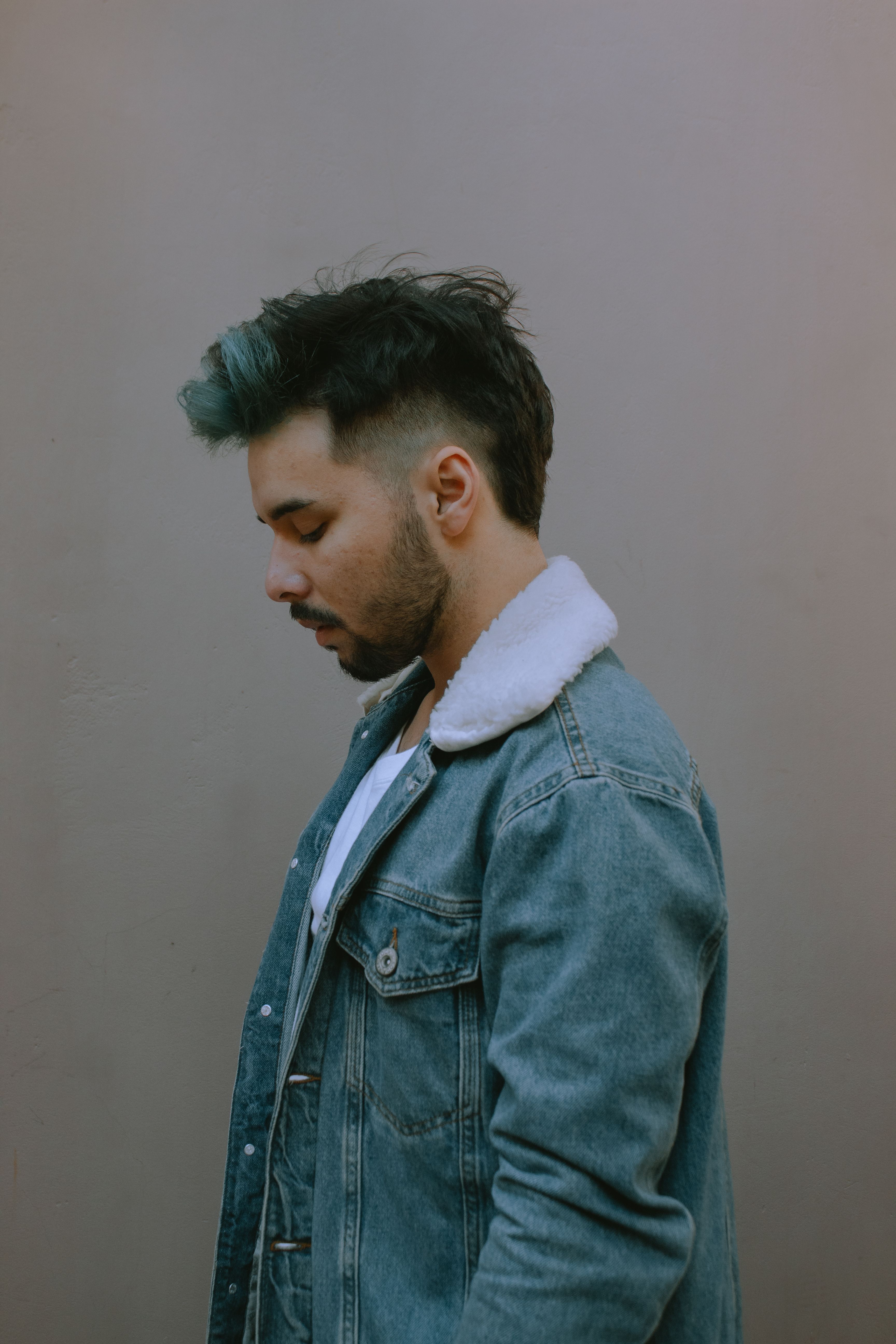 A Man in Denim Jacket Looking Sideway · Free Stock Photo