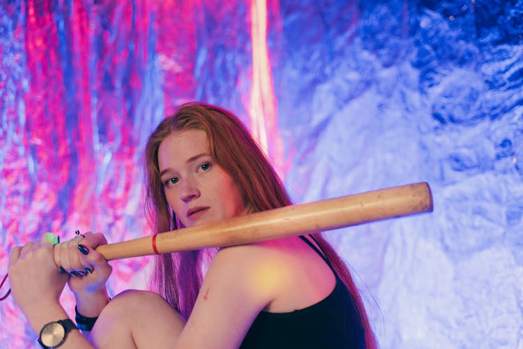 A Woman Holding A Baseball Bat