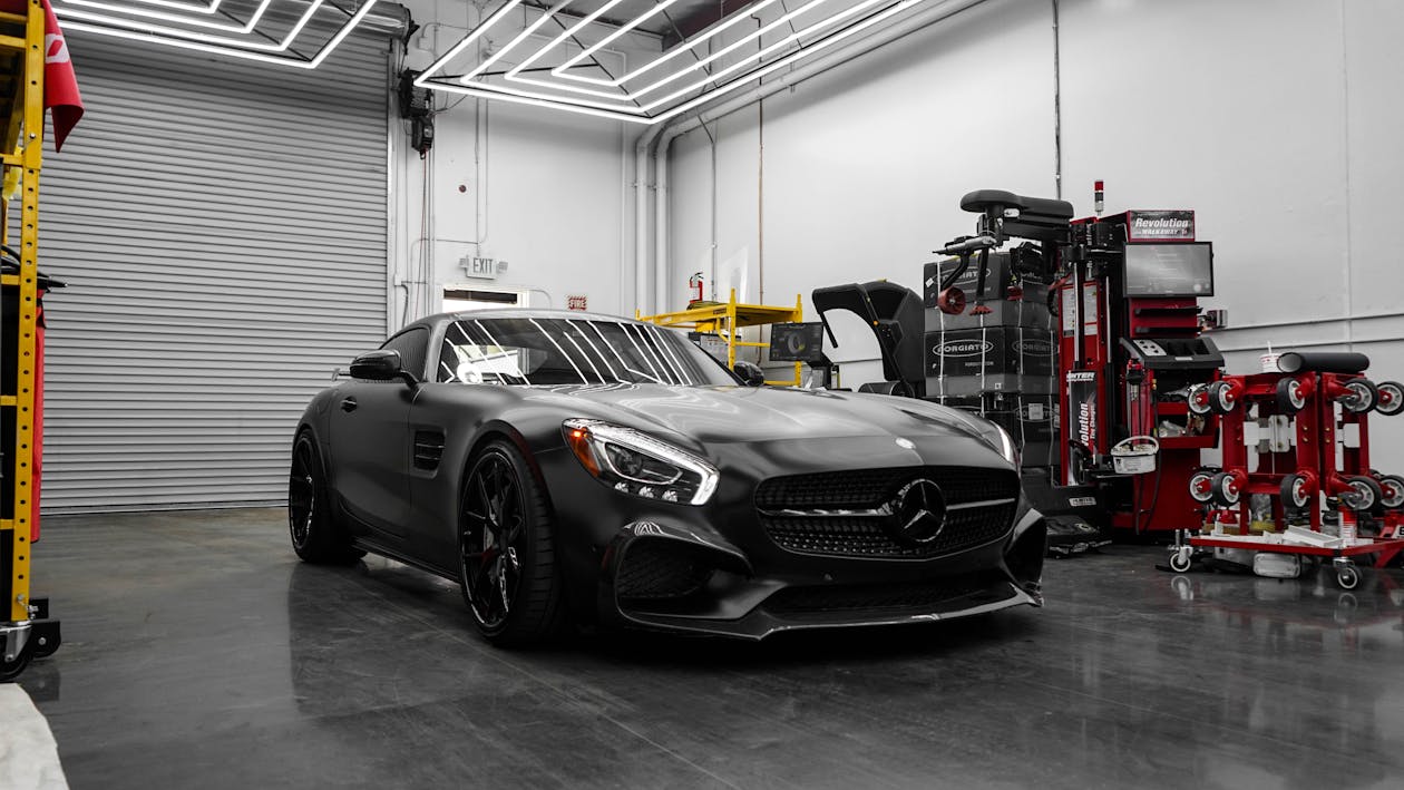 Free Matte Black Mercedes Benz Parked in a Garage Stock Photo