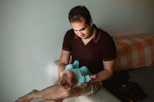 Free Father with baby on hands Stock Photo