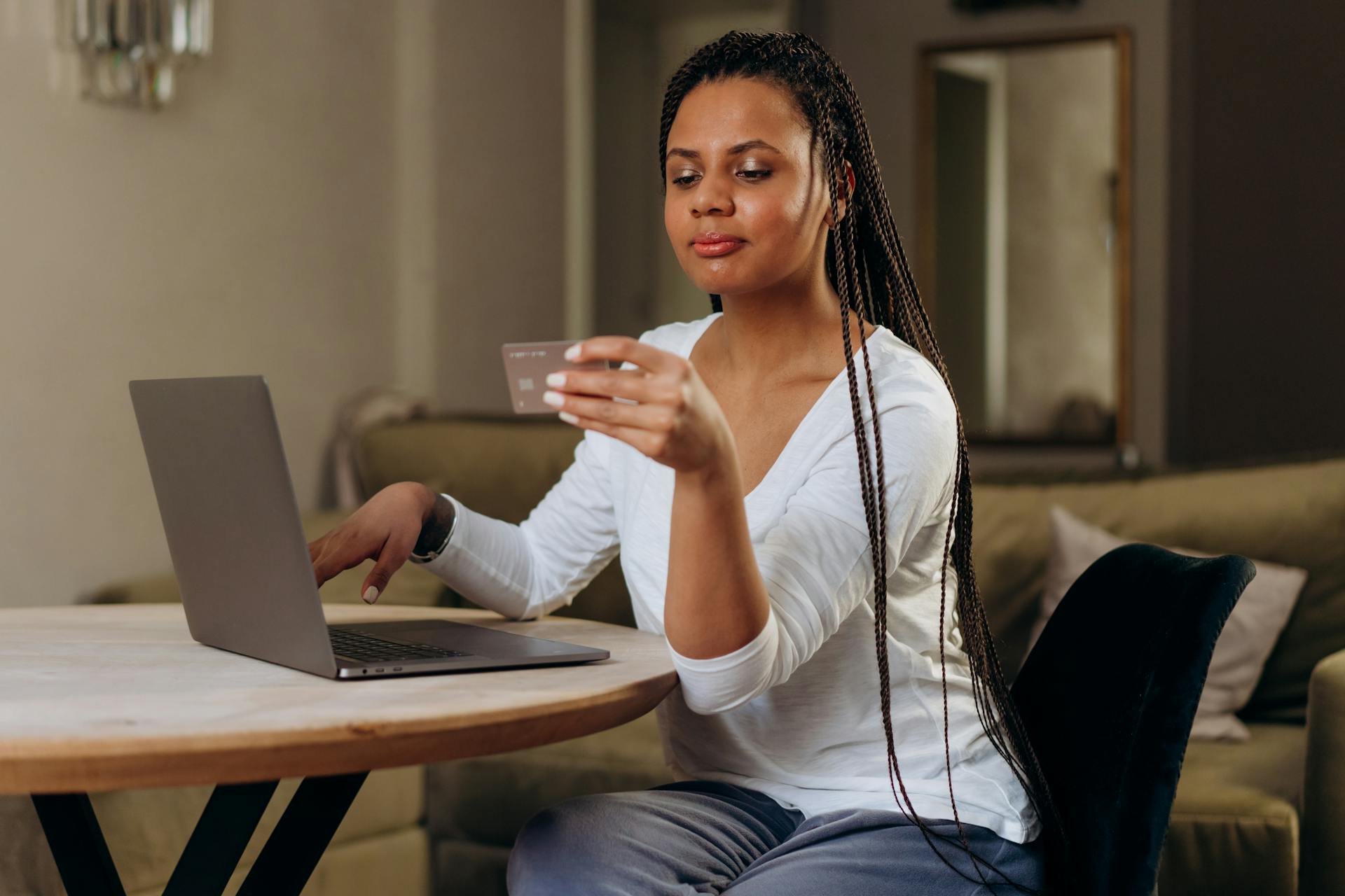 A Woman Using Her Credit Card Online