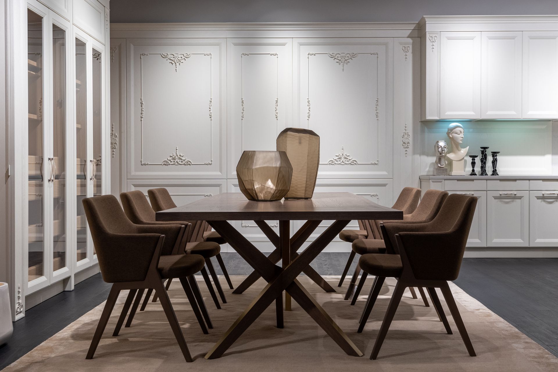 Sophisticated dining room featuring modern furniture and elegant decor in a cozy setting.