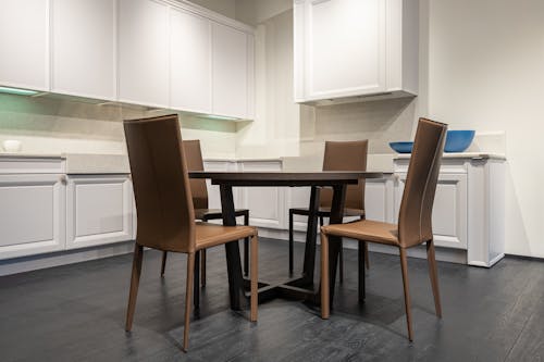 Empty dining table in modern light kitchen