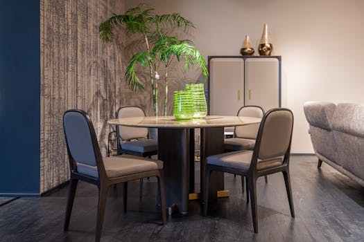 A stylish and cozy dining area with a modern table, chairs, and decorative elements.
