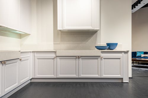 Free Empty white kitchen units in modern apartment Stock Photo