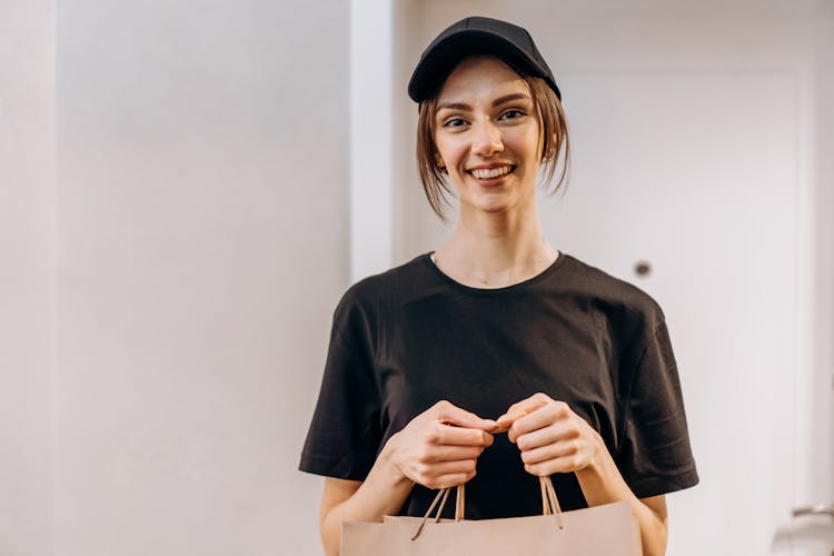 A Woman In Black Crew Neck T-shirt Smiling