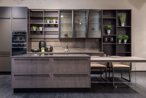 Free Contemporary kitchen interior design with empty dark furniture and decorative vases and plants Stock Photo