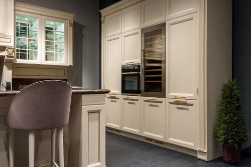 Free Trendy interior design of modern kitchen with white classy cupboard and cozy high chair in contemporary apartment Stock Photo