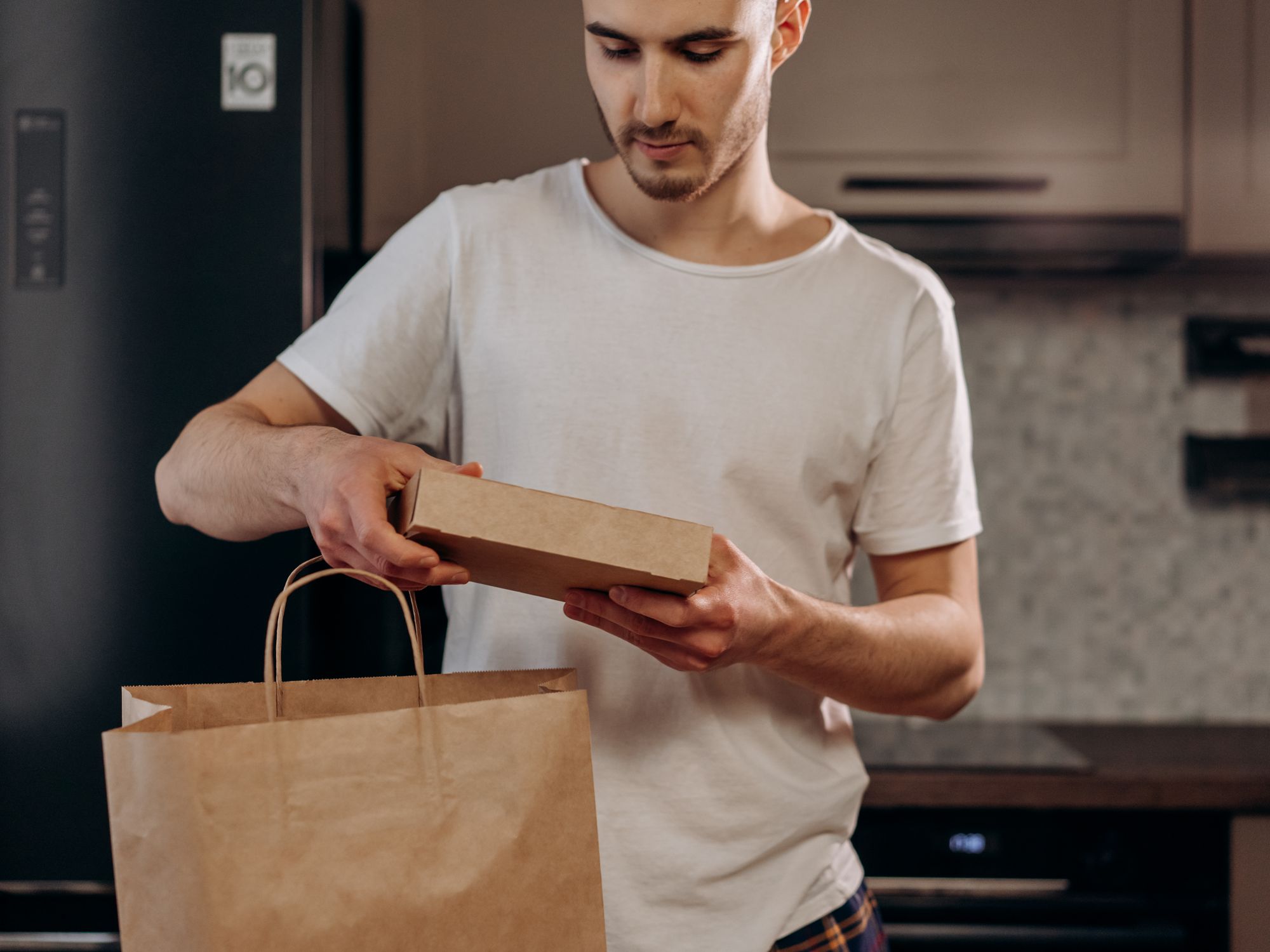 Packing Services in Thurlton, East of England — professional packer wrapping fragile items in a box