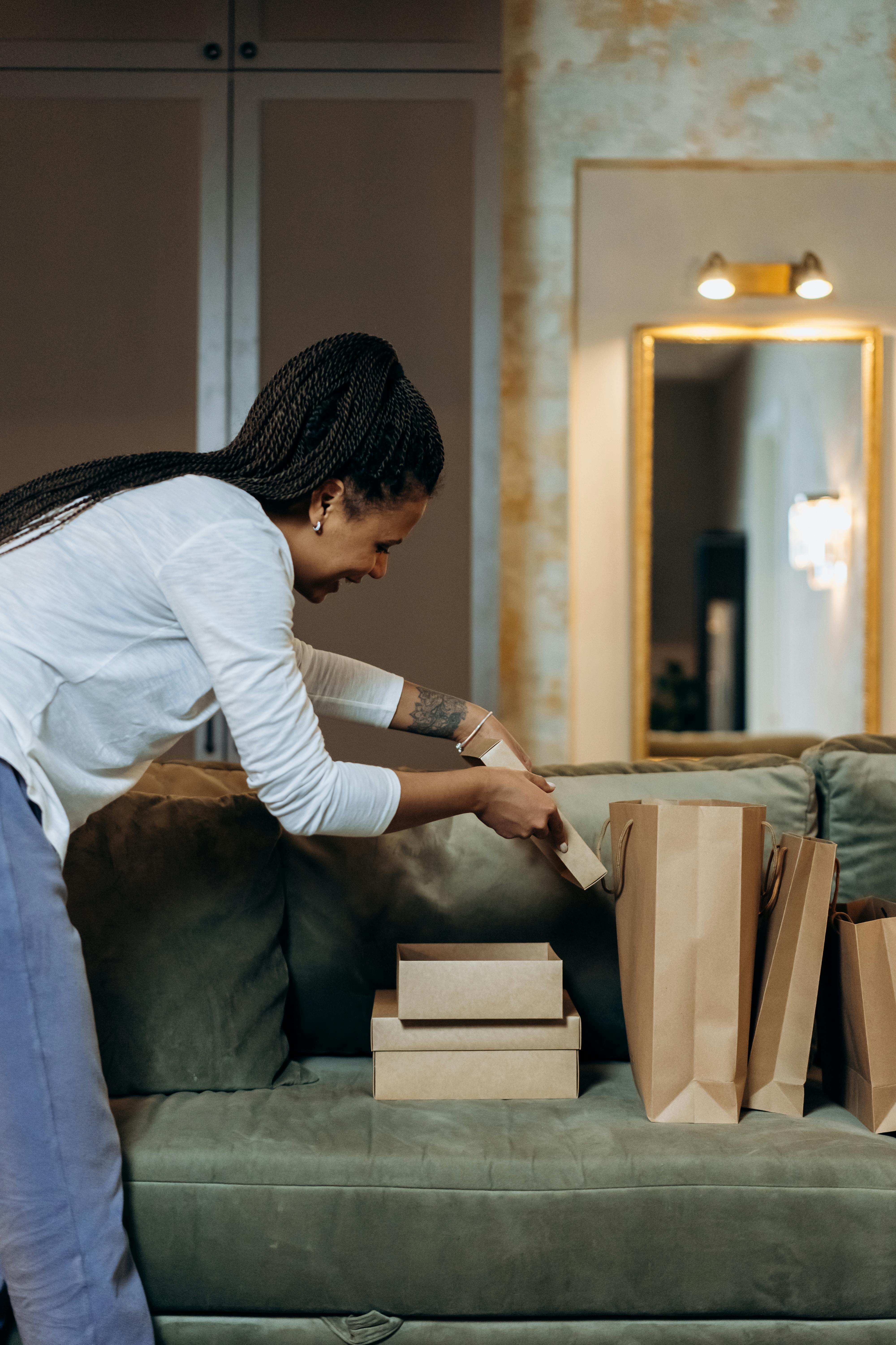 a woman opening the boxes of deliveries