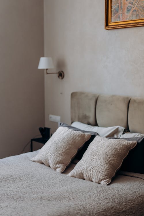 Free Pillows Arranged in Bed Stock Photo