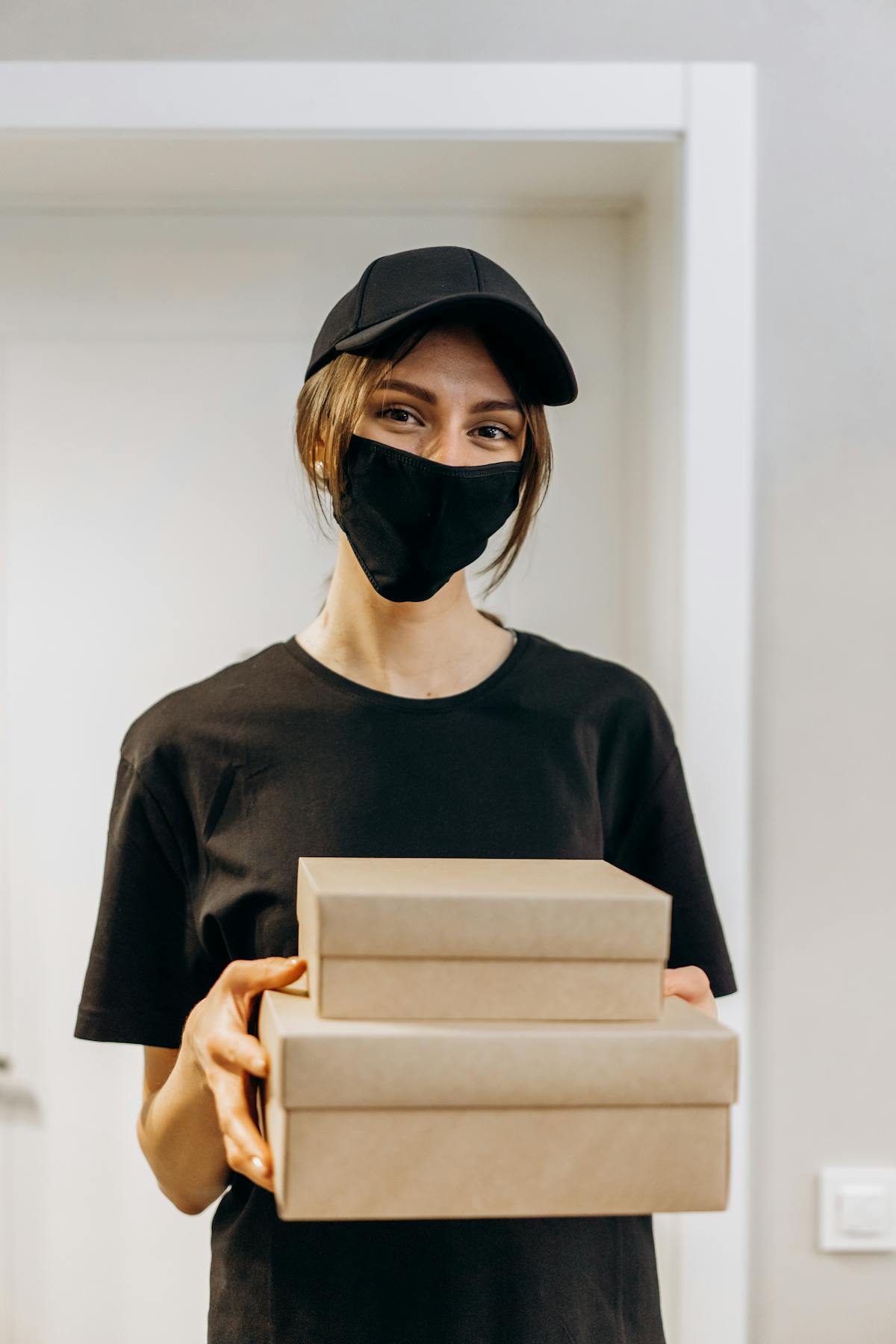 Person listening to music on smartphone through wireless headphones