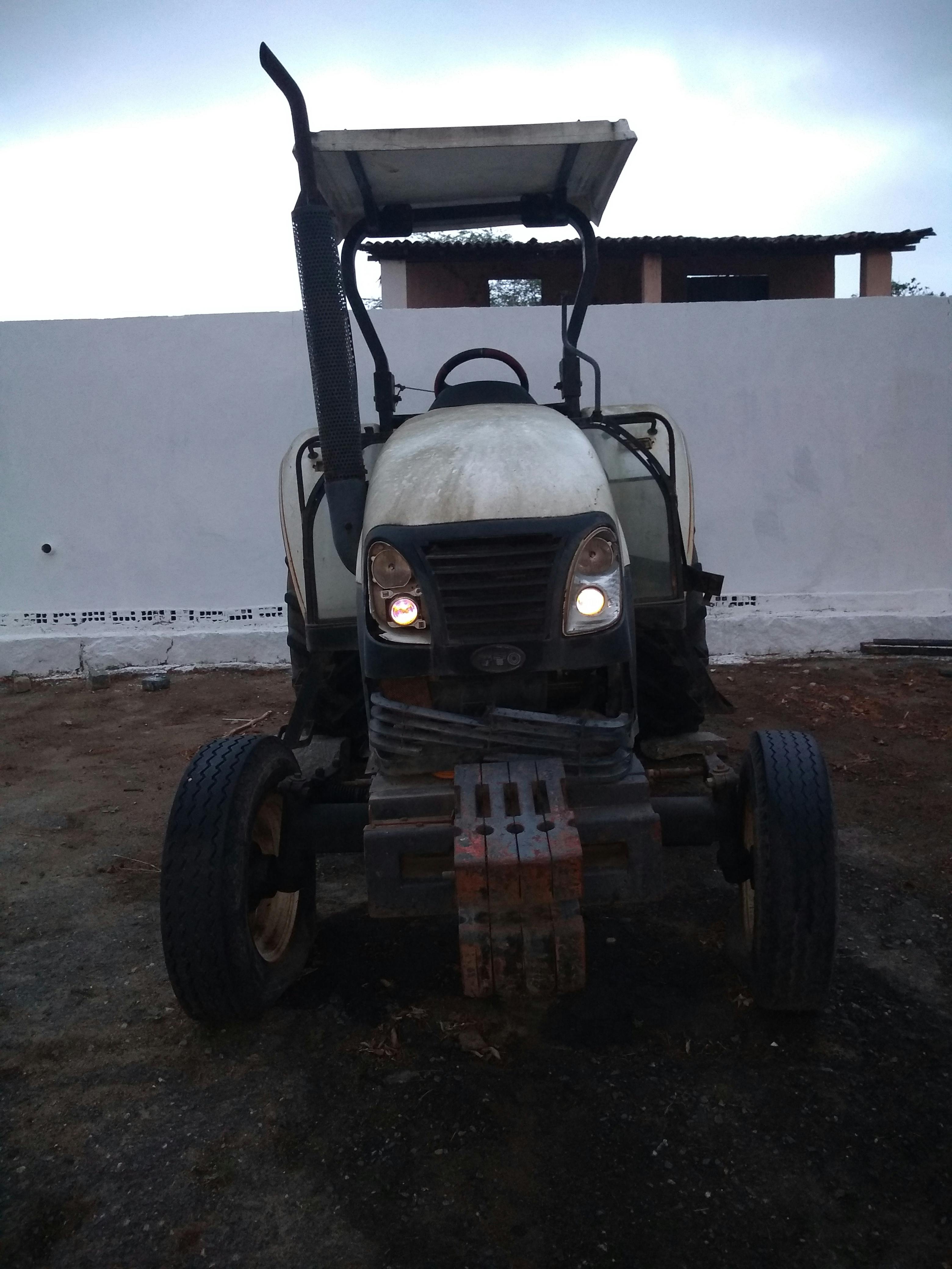 Melting glacier ice with blue meltwater pools and exposed rock indicating climate warming