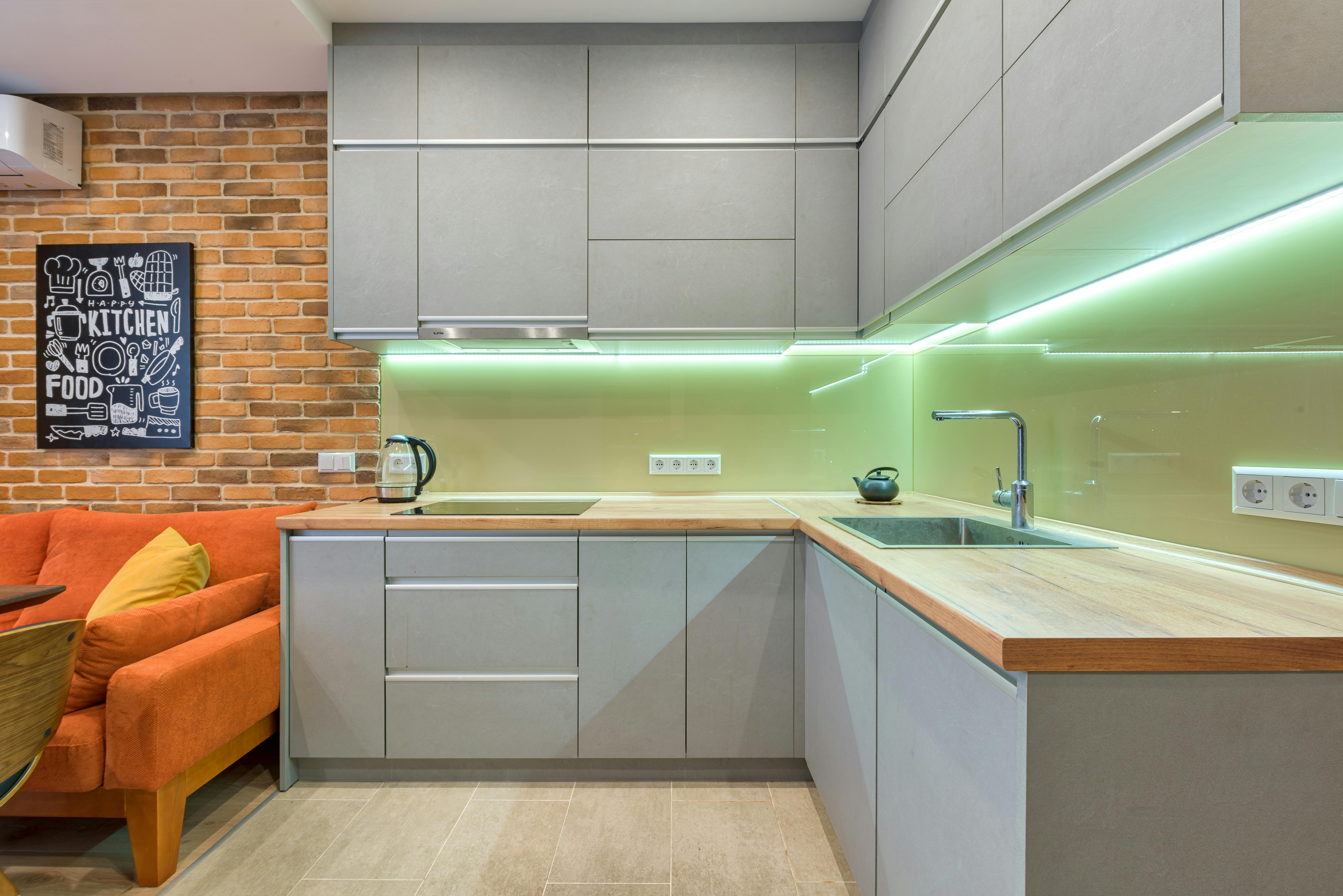 light green sheet glass backsplash in the kitchen