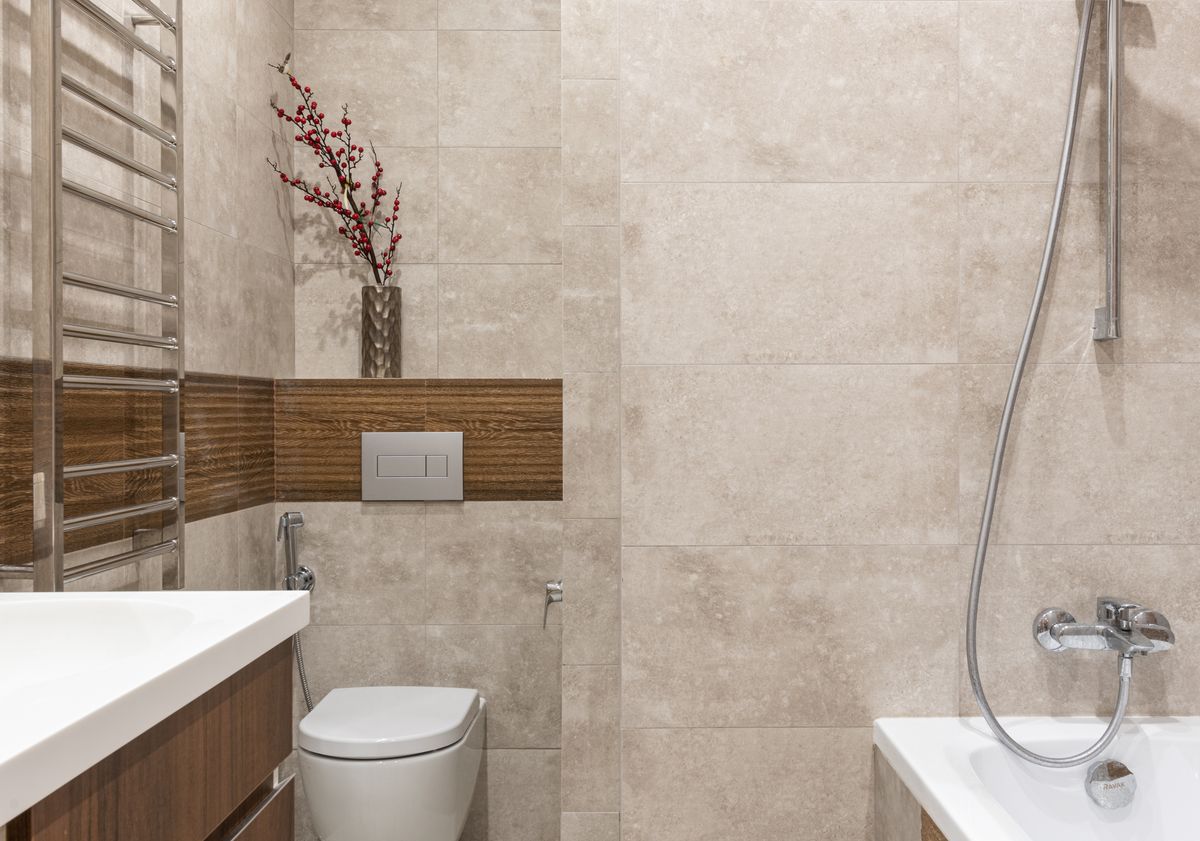 Stylish bathroom featuring contemporary fixtures and elegant tile design. Stock Photo.