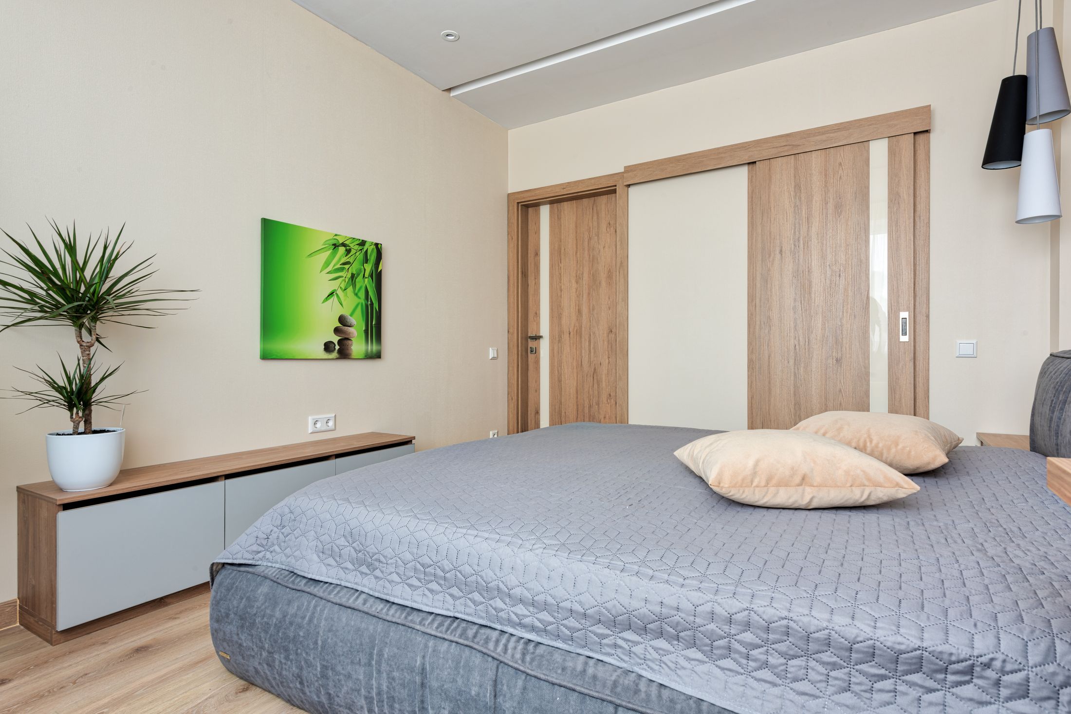 Bedroom with wooden sliding wardrobe doors