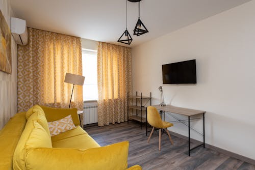 Interior of modern apartment in yellow colors