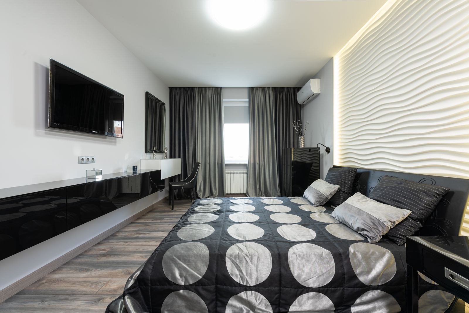 Modern bedroom with dark curtains for privacy and room darkening