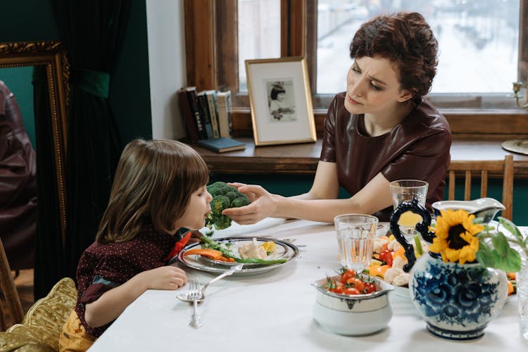 A Mother And Child Having A Healthy Dinner