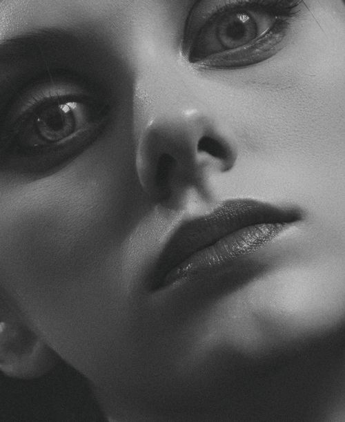 Free Close-up monochrome portrait capturing emotion and depth in a woman's gaze. Stock Photo