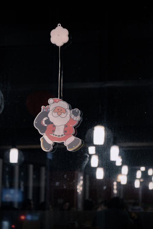 Santa Christmas Decoration Hanging on a Window