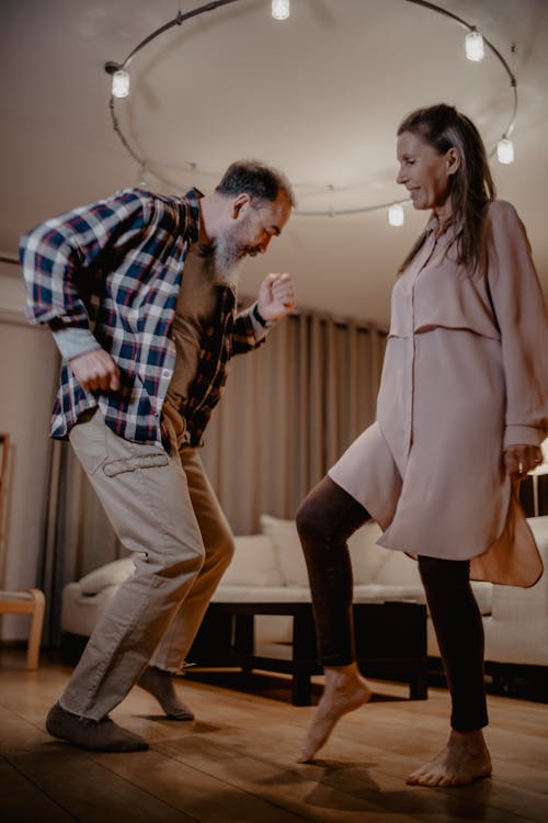 Free A Couple Dancing in the Room Stock Photo