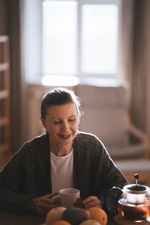 A Woman Sitting at the Table