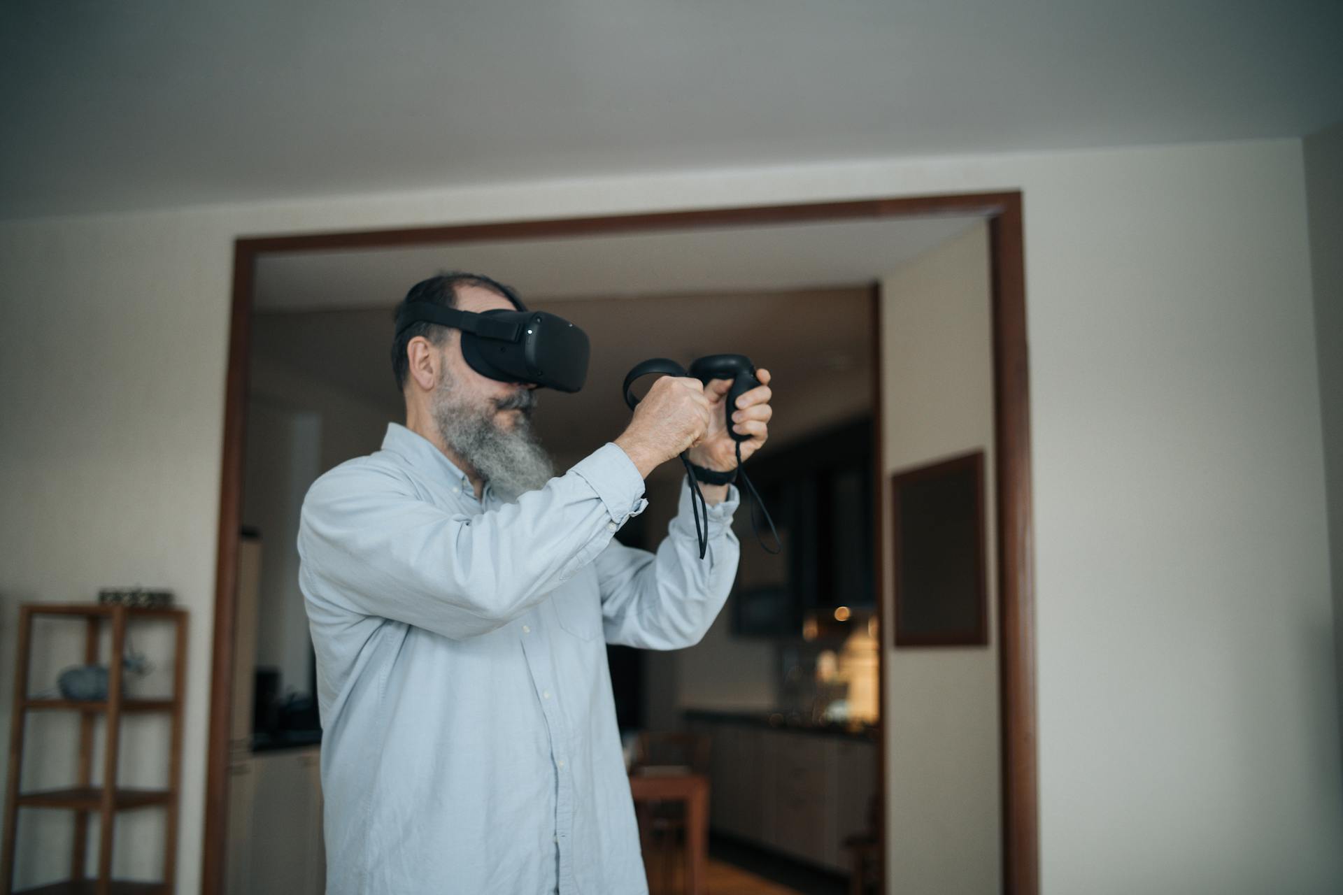 Man in White Dress Shirt Holding Black Telephone