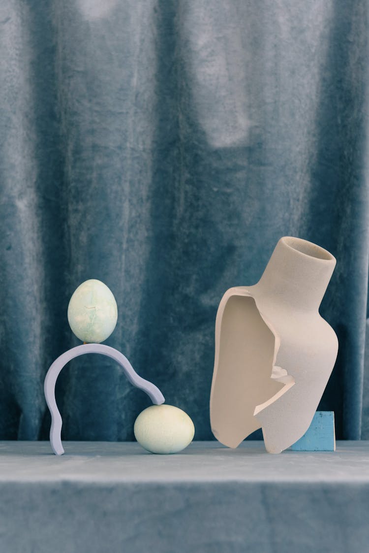 A Broken Ceramic Vase On Gray Surface 