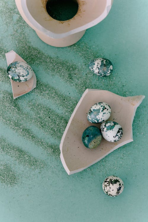 Free Painted Eggs on Broken Ceramic Pieces Stock Photo