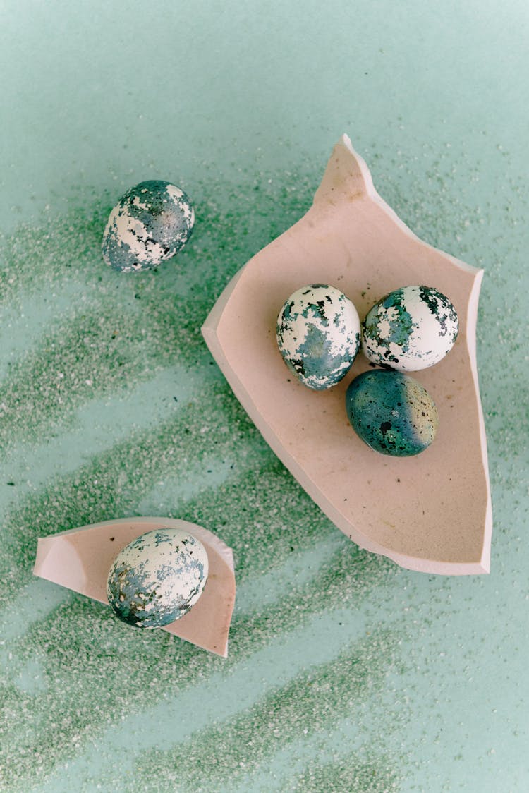 Painted Green Eggs On Broken Ceramic Pieces