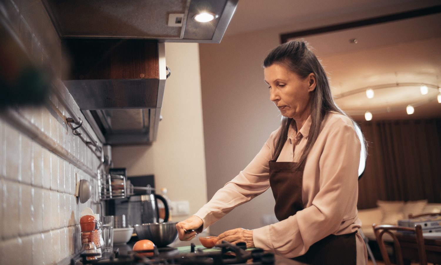 Senior at home in a bright kitchen enjoying comfortable living.