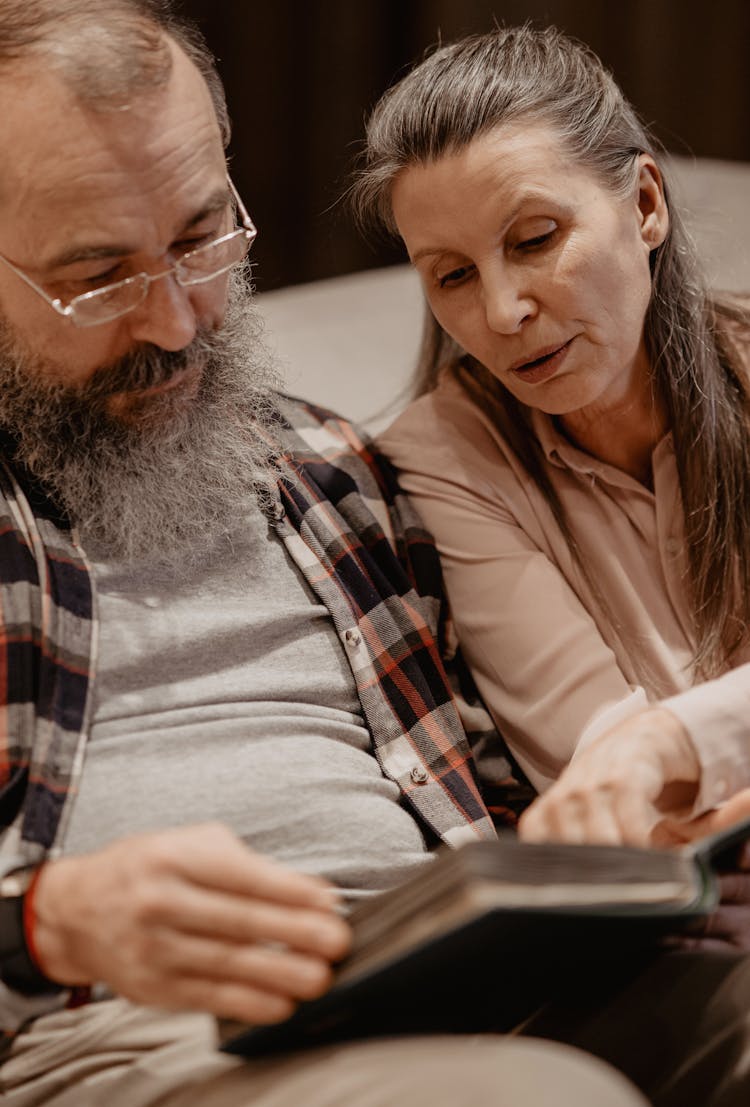 Couple Looking At Photos