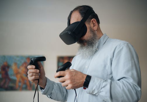 Senior adult playing with VR headset and controllers indoors, exploring metaverse.