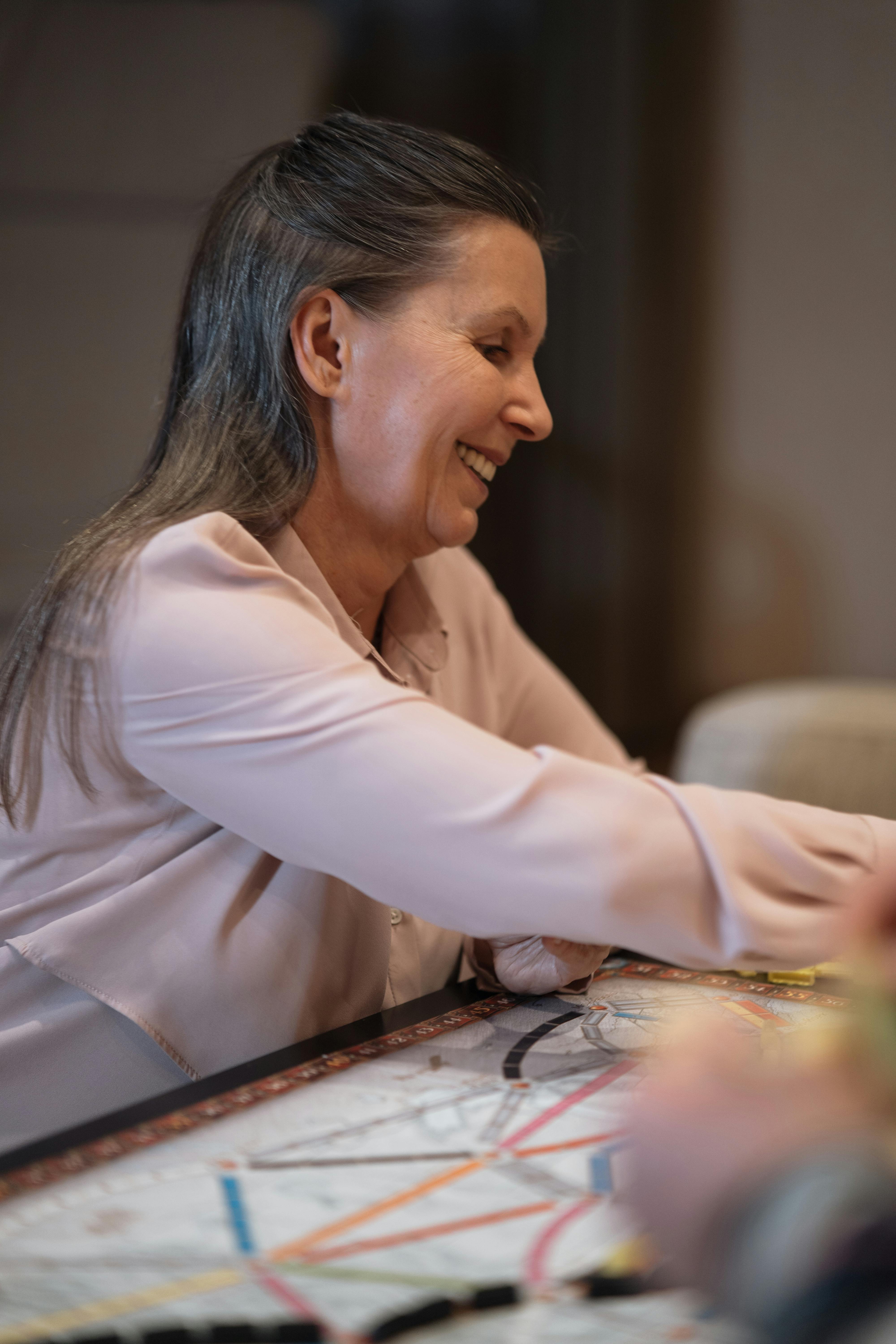 woman in white long sleeve shirt sitting on chair