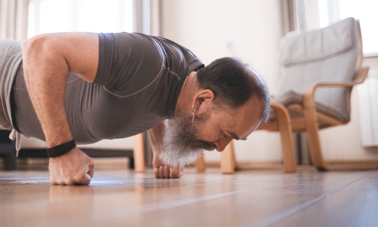 Bearded Man In Gray Crew Neck T-shirt Doing Push Up