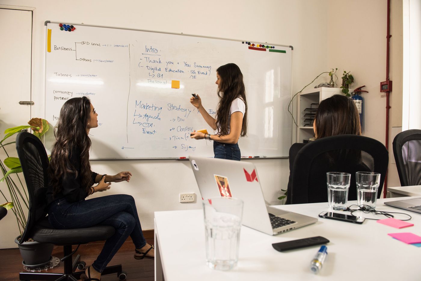Consultants analysing data and strategy at a conference table