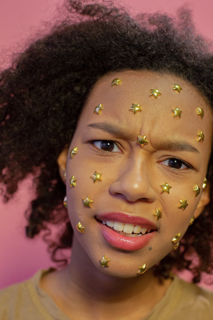 Indignant Black Girl With Star Rhinestones On Face