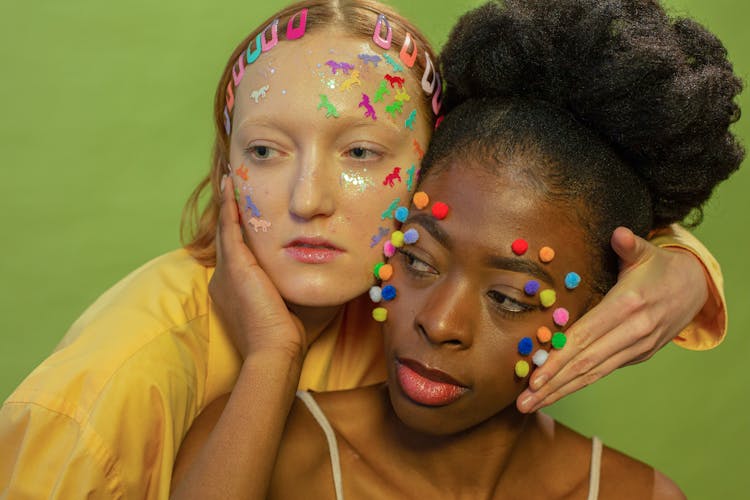 Diverse Women With Colorful Stickers And Pom Pom On Faces